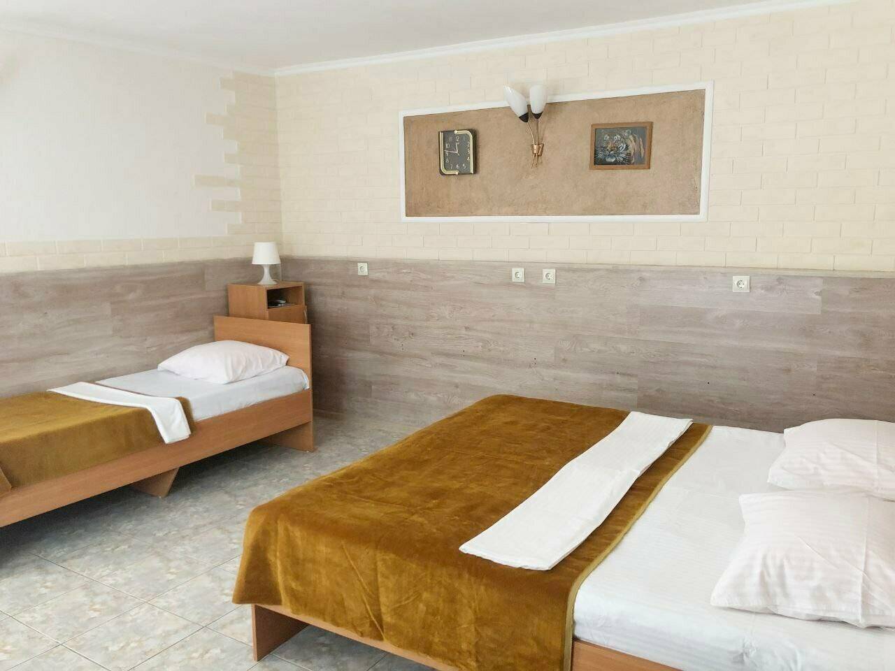 Фотографии номера Стандартный четырехместный номер в Гостинице Домик у моря Анапа